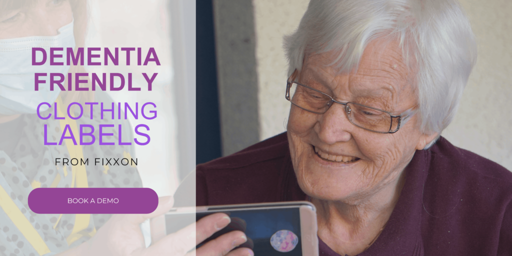 A care home resident watching a video on a phone.