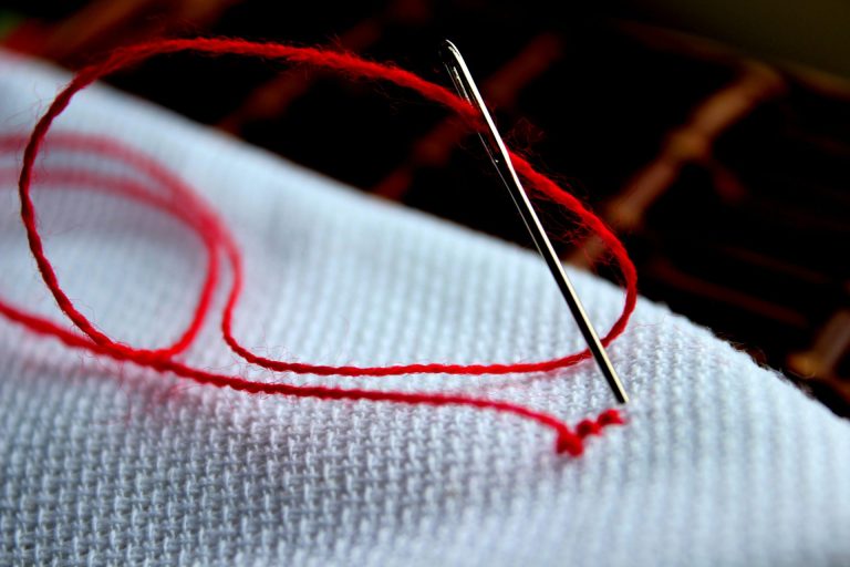 Needle and thread for sew on labels